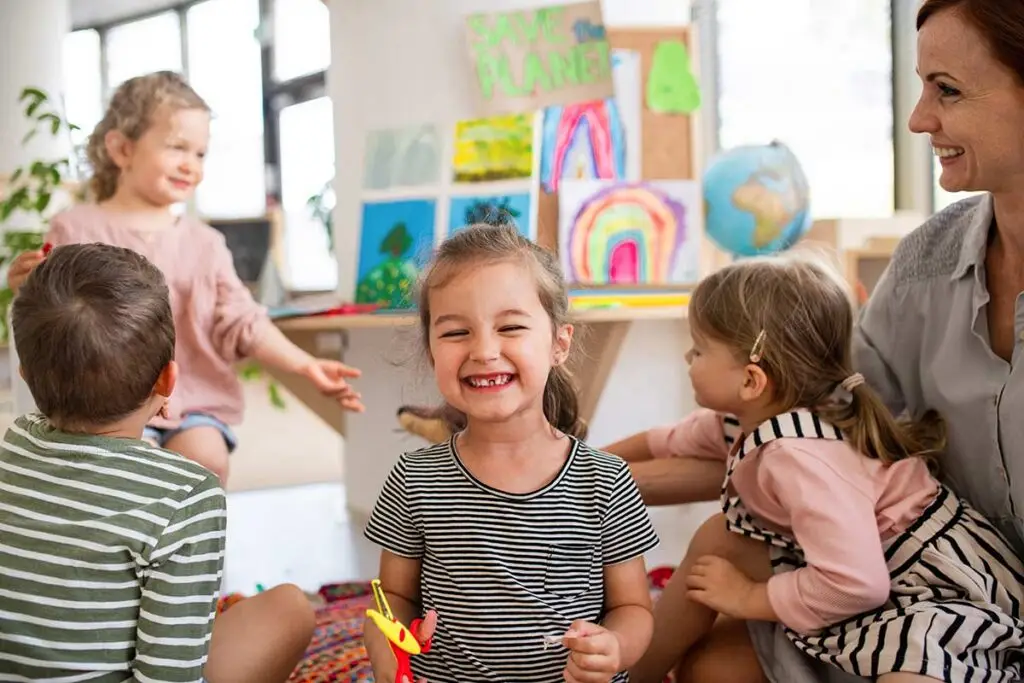 Teacher with children in a daycare classroom.